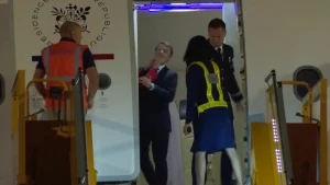 Emmanuel Macron's wife is captured in a viral video shoving him in the face as France's first spouse arrives in Vietnam.